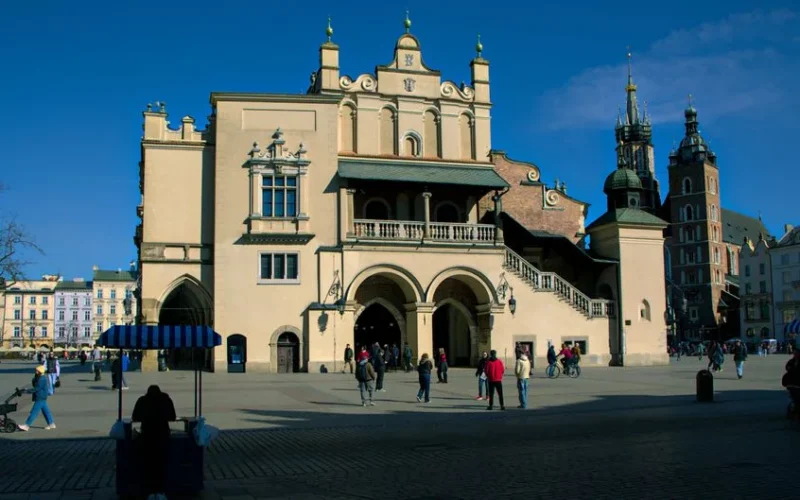 Explore the historic and vibrant architecture of Kraków's Market Square, a cultural hub.
